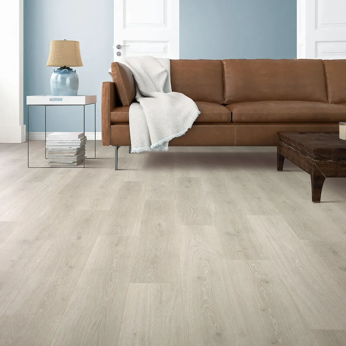 Mohawk Laminate in a light, almost white wood tone in a living room | Fantastic Floors