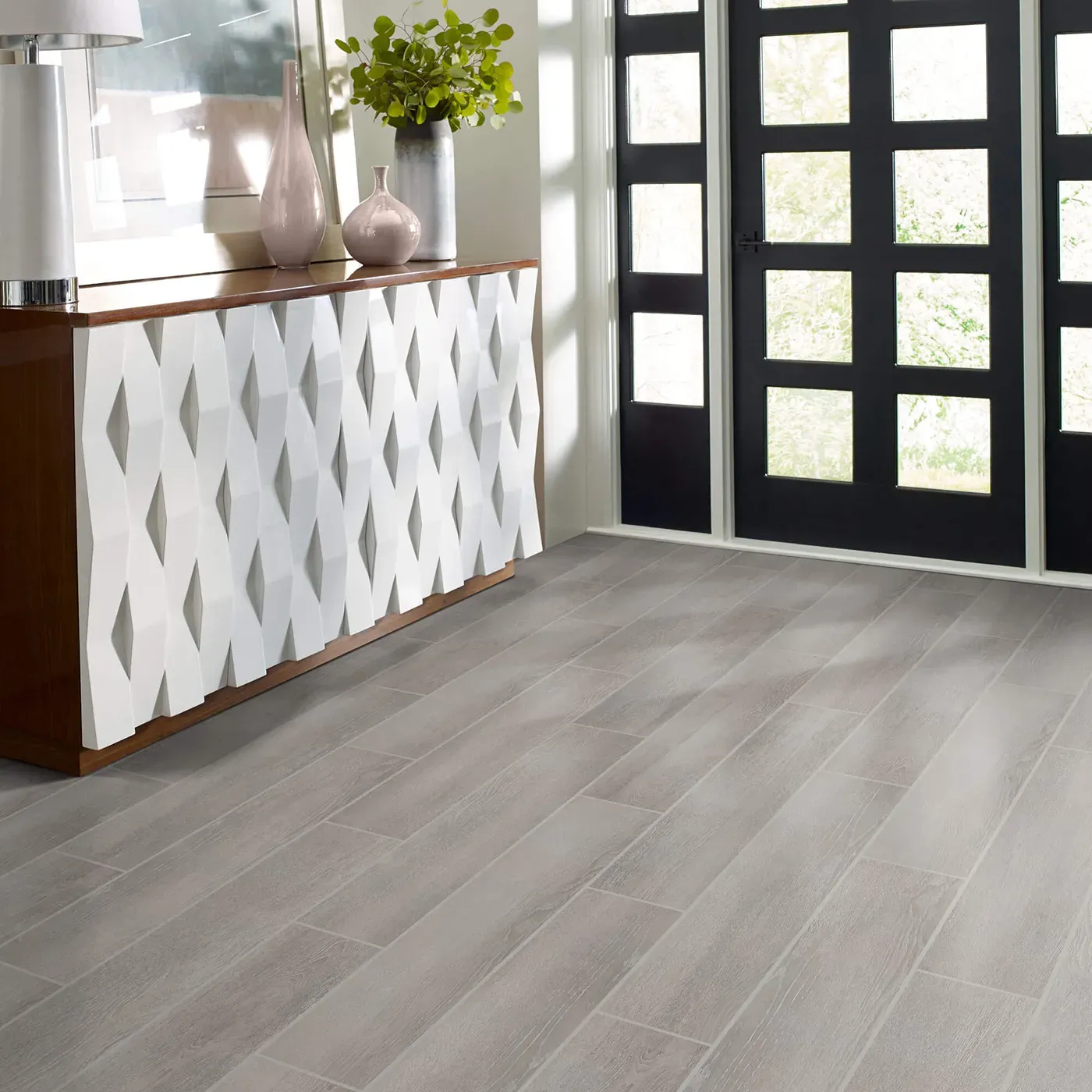 Tile with a light gray wood look, in an entryway | Fantastic Floors