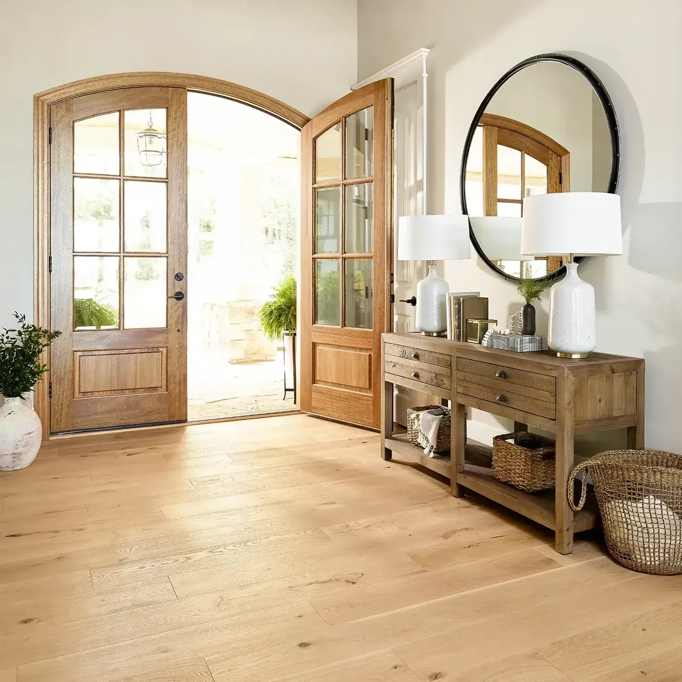 Shaw Floors light hardwood in an entryway with large wooden double doorsy | Fantastic Floors